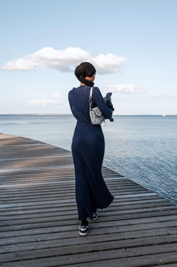 I Try to Touch Her and Find the Void ("Women Looking at Sea" series), 2025. by Maria Castro, exhibited at Aurea Photo Gallery.
