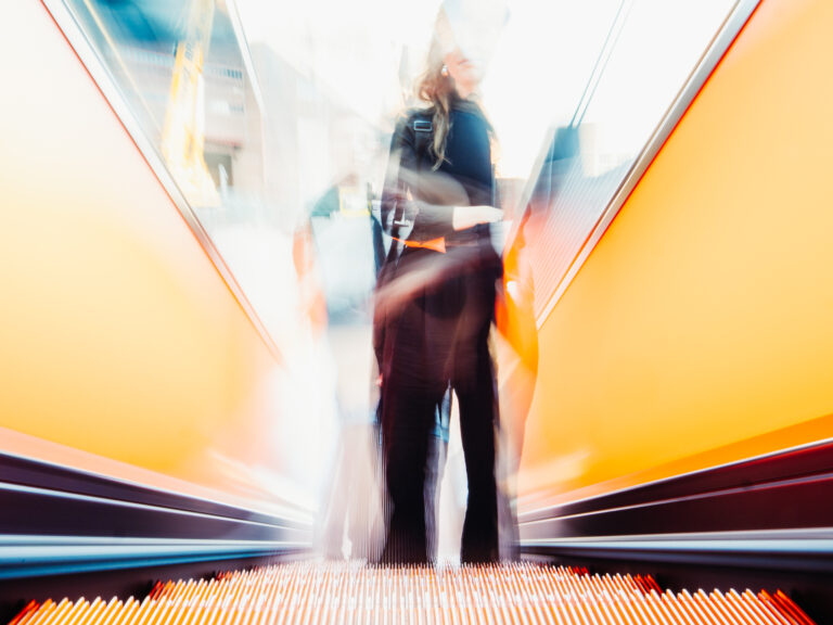 Couple in Orange blur, 2025. by Marion Kuhn, exhibited at Aurea Photo Gallery.