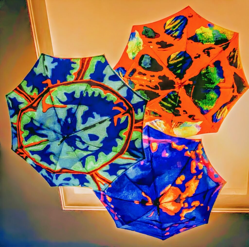 Multi colorful Umbrellas Suspended From The Ceiling. by Michael Watz, exhibited at Aurea Photo Gallery.