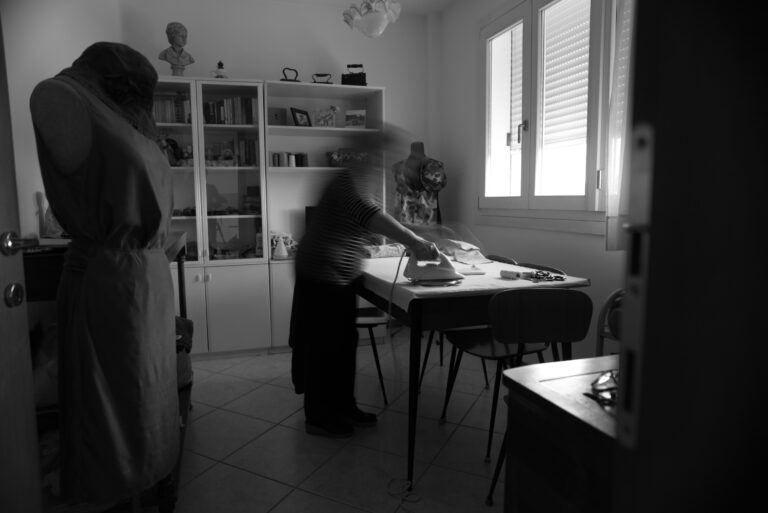Paolina ironing, 2026. by Nicola Fantin, exhibited at Aurea Photo Gallery.