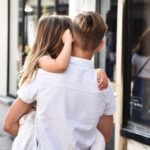 Holding my sister, 2025. by foto.m, exhibited at Aurea Photo Gallery.